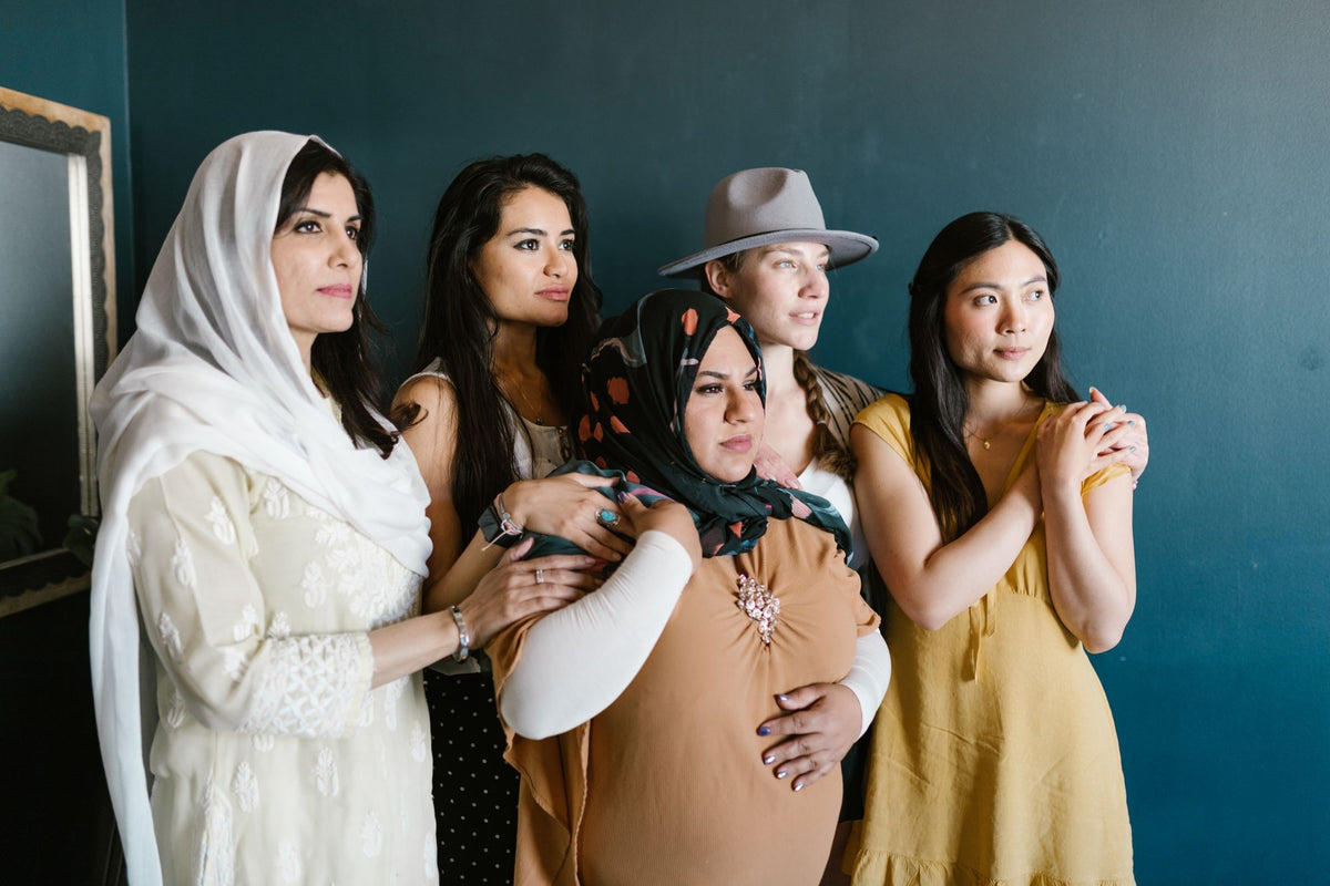 Five women of different ages and skin tones, side by side