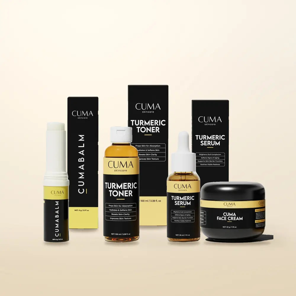 CUMA serums and a gold-lidded jar arranged on marble